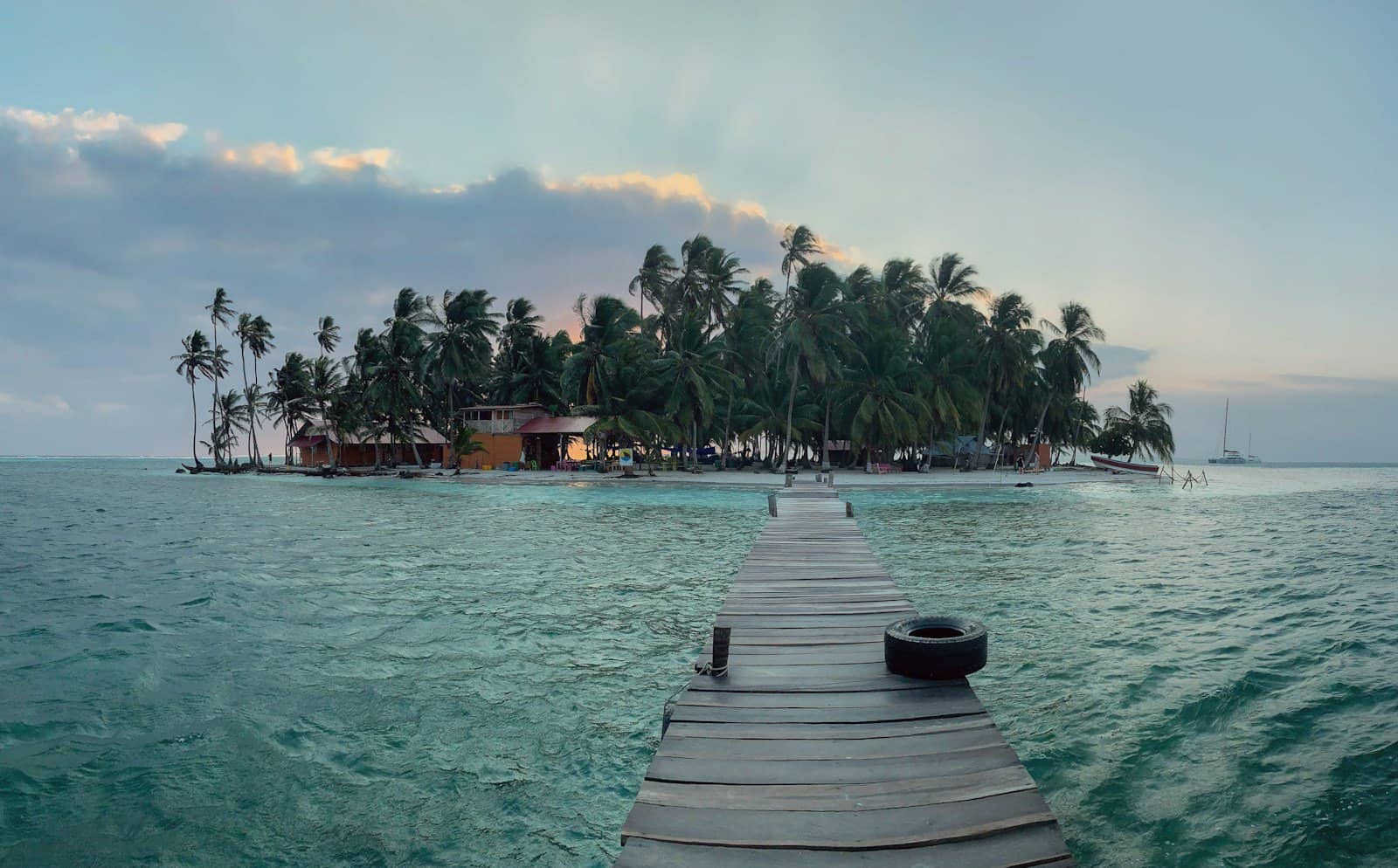 brown wooden dock on body of water during daytime